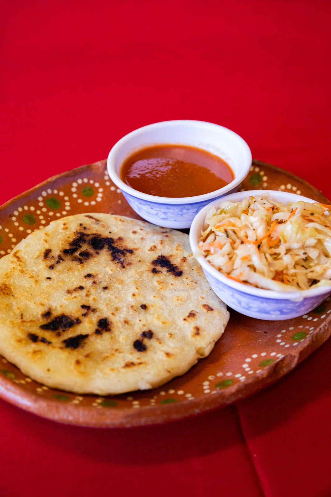 Pupusa with curtido and salsa