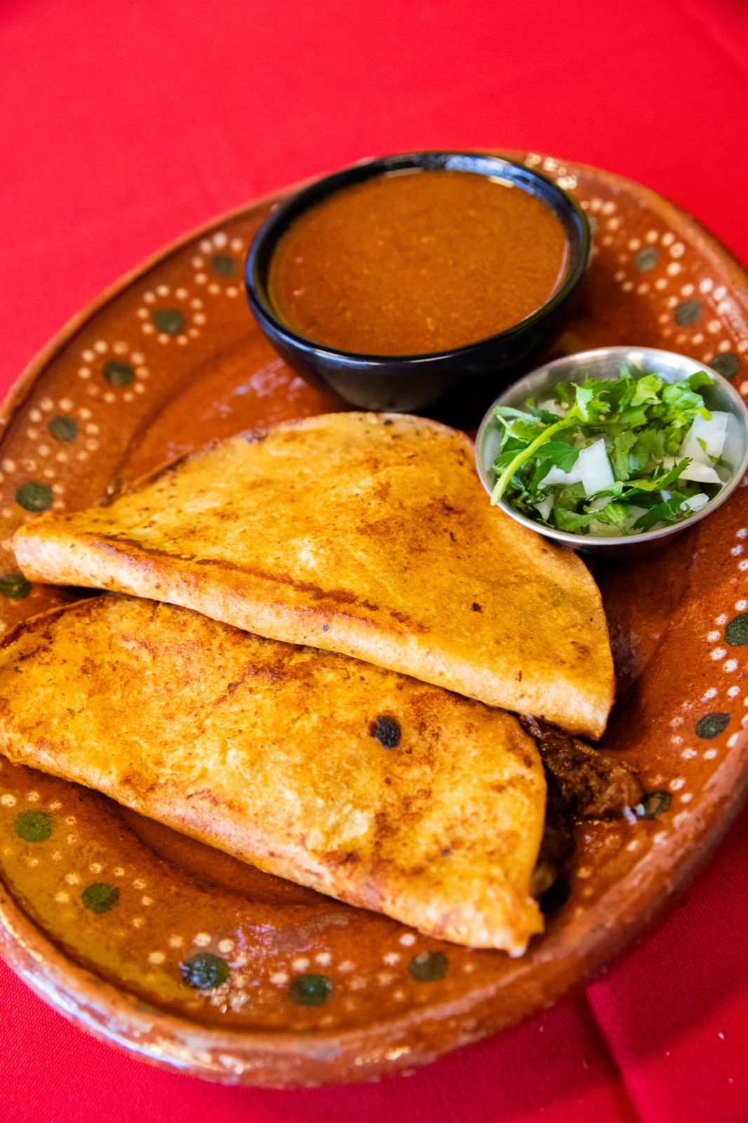 Quesabirrias with consomé for dipping